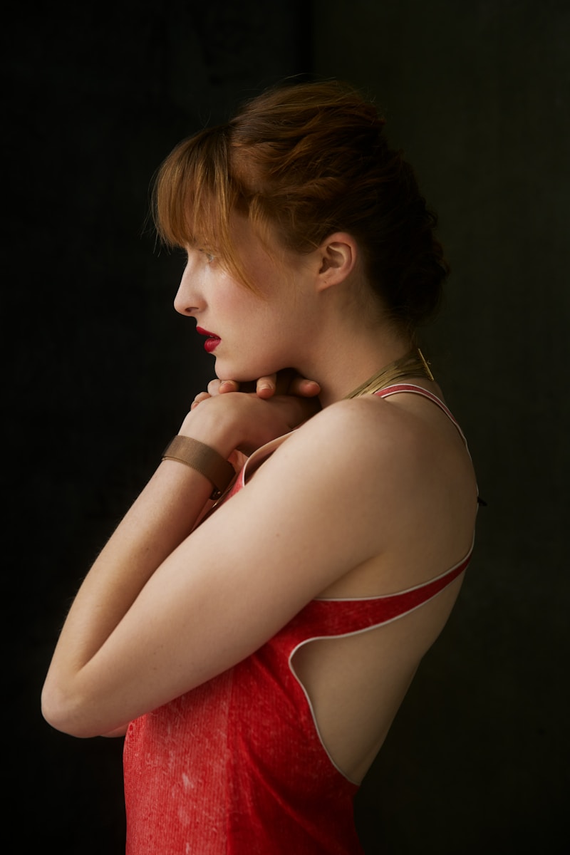 A woman in a red dress posing for a picture