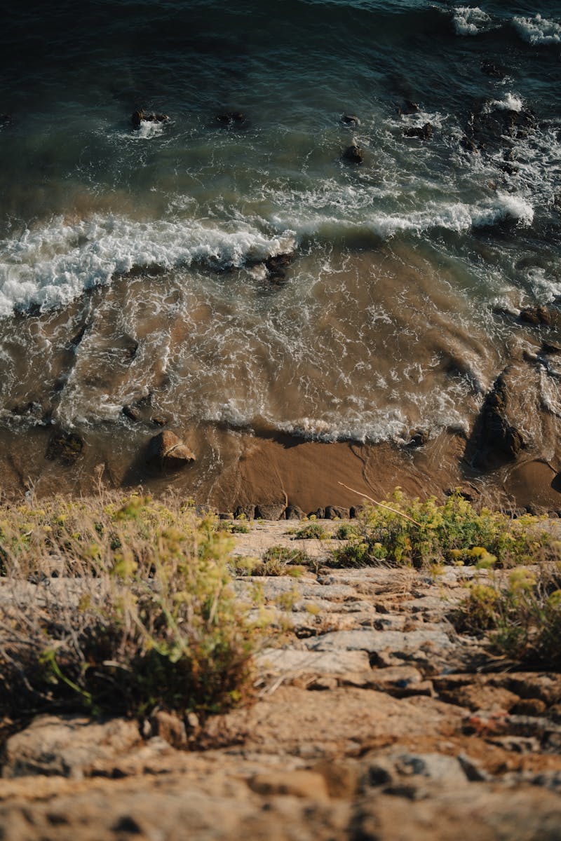 Breathtaking view from Ajaccio cliffs with waves crashing against the shore.