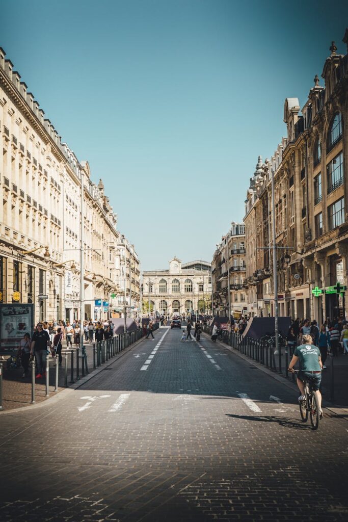 Explore the bustling streets of Lille, France, showcasing beautiful historic architecture and urban life.