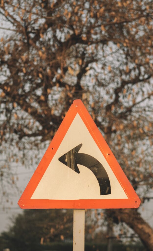 a street sign with an arrow pointing to the right