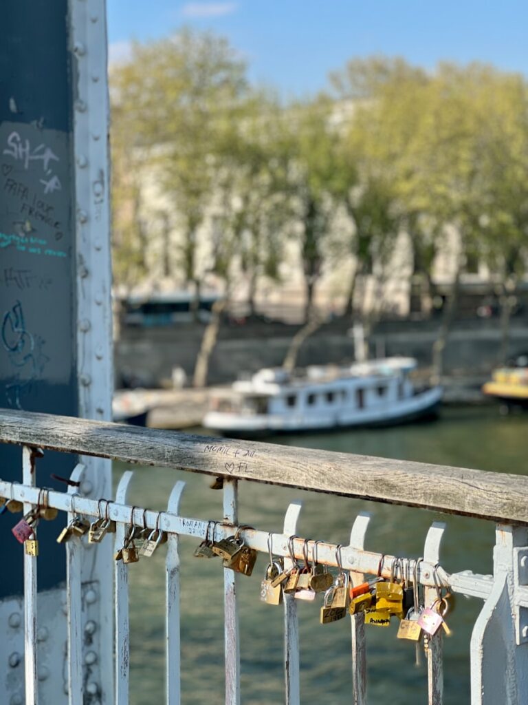 a bridge with a bunch of padlocks attached to it