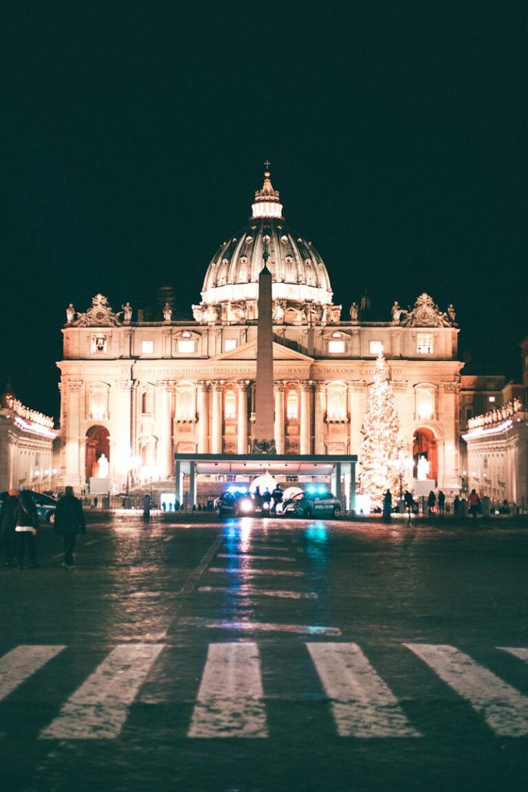 Night view of St. Peter's Basilica with Christmas Tree in Vatican City.
