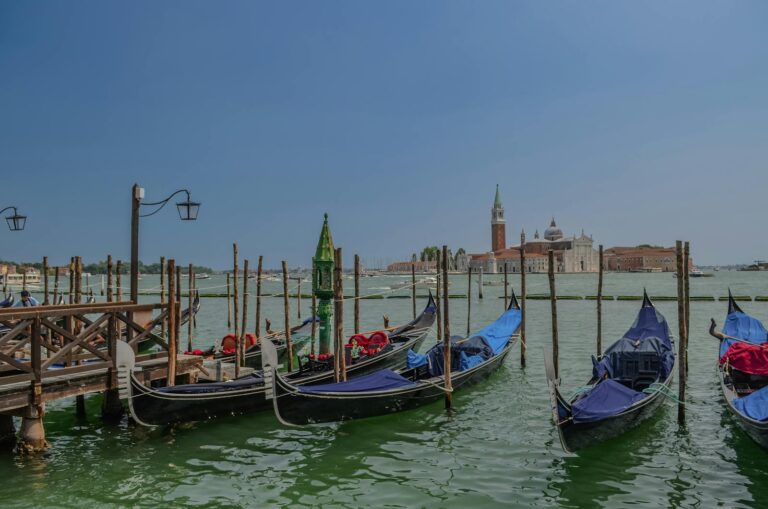 Serene view of gondolas docked by the Basilica di San Giorgio Maggiore in Venice, Italy.