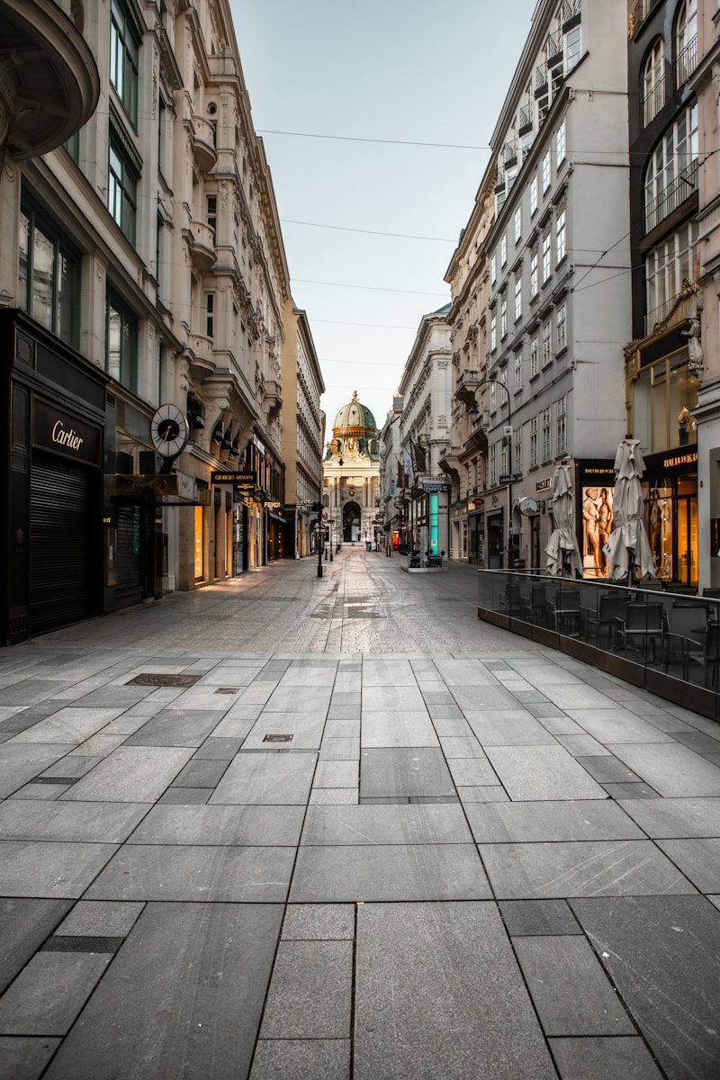 <strong>Lost in Translation, Found in Connection: The Delightful Chaos of Street Language </strong> people walking on sidewalk between buildings during daytime