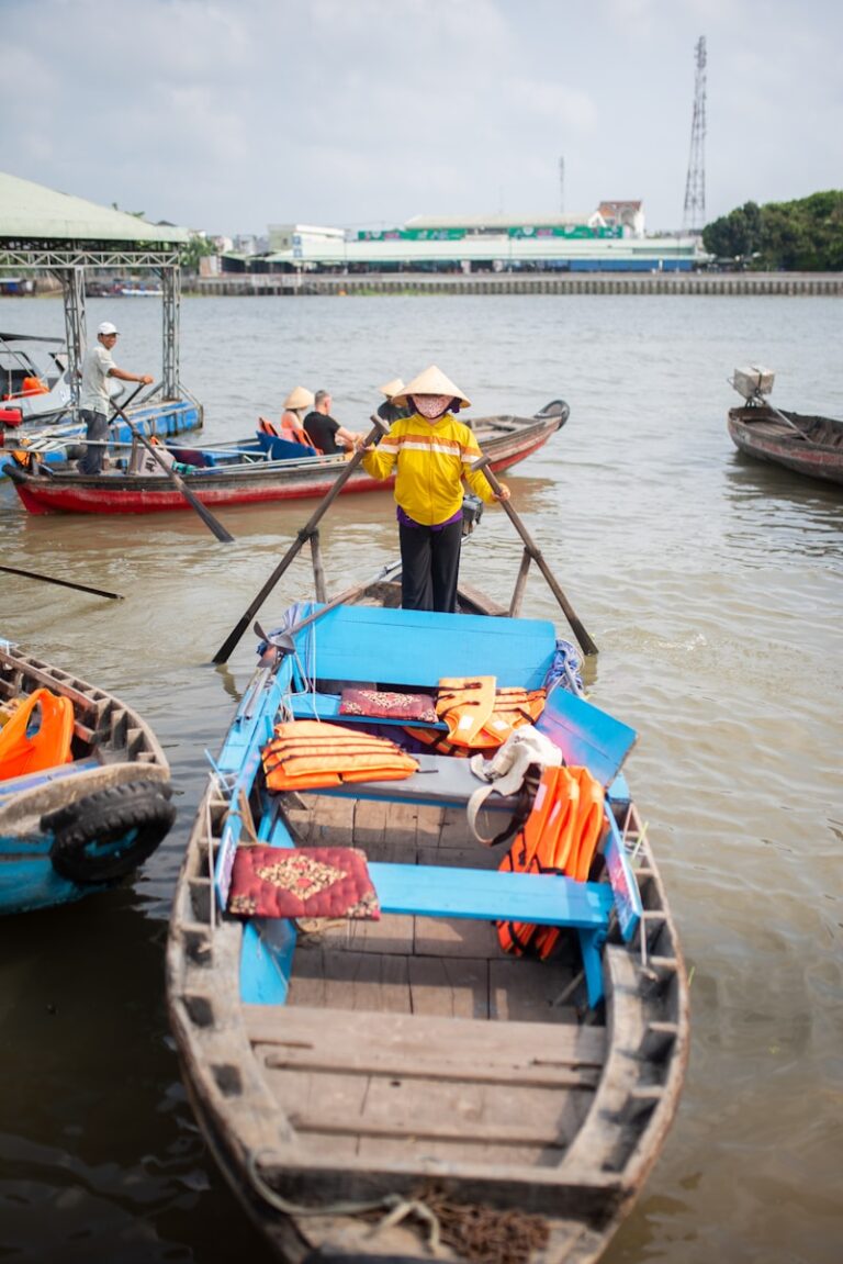 A woman standing on a boat in the water