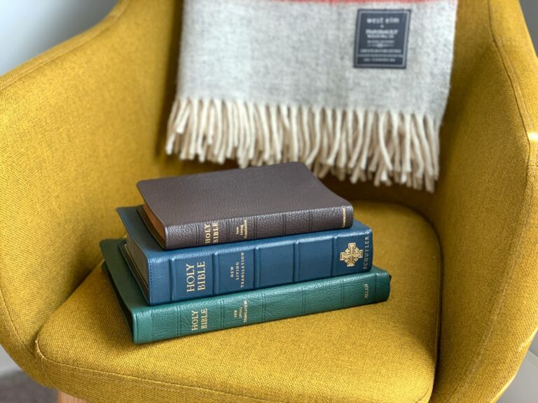 Black and green books on yellow textile