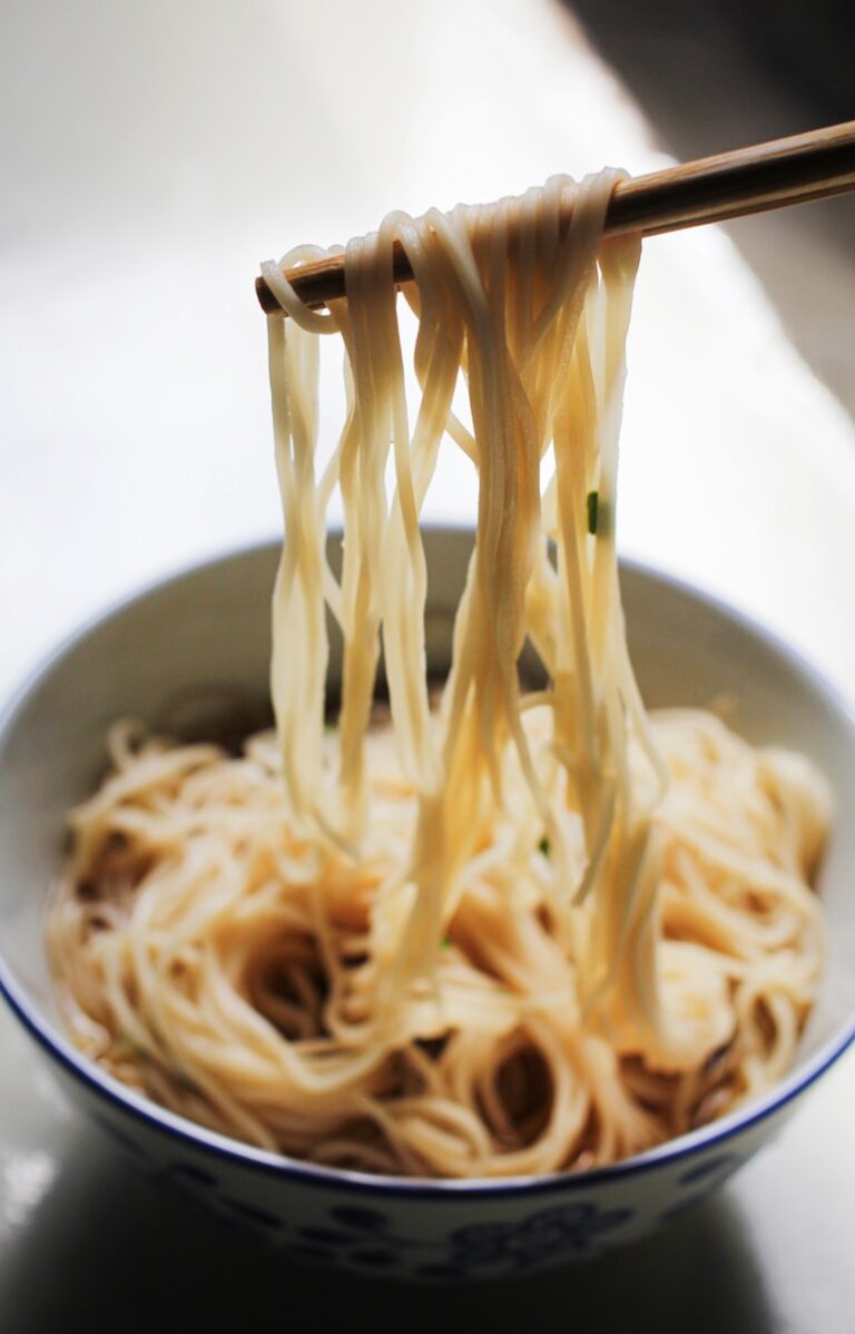 Noodle on black ceramic bowl