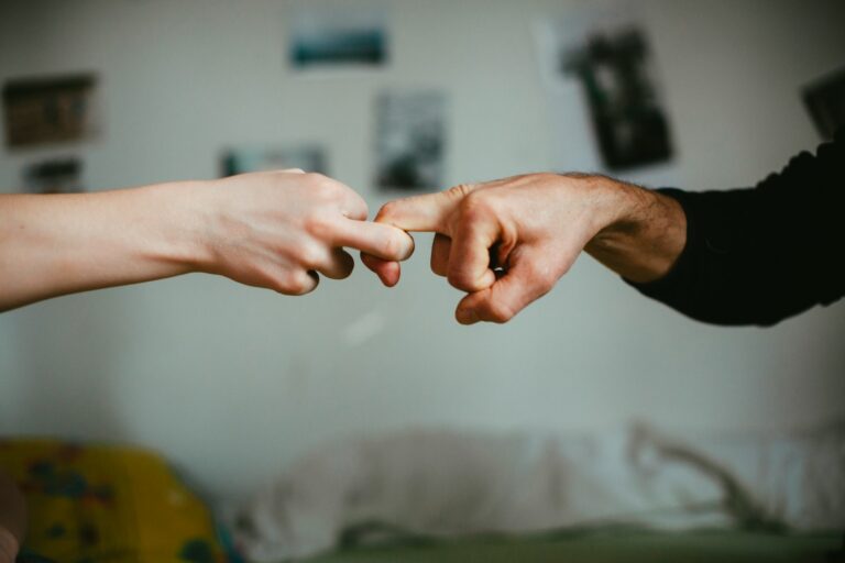 Person holding persons hand