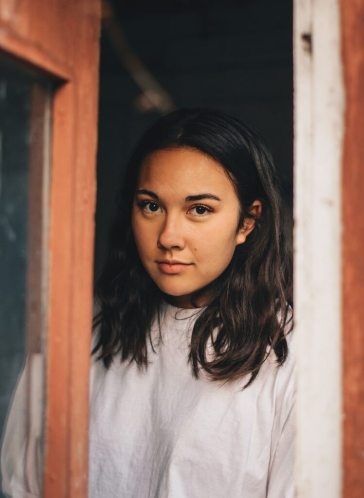 A woman is steering at door