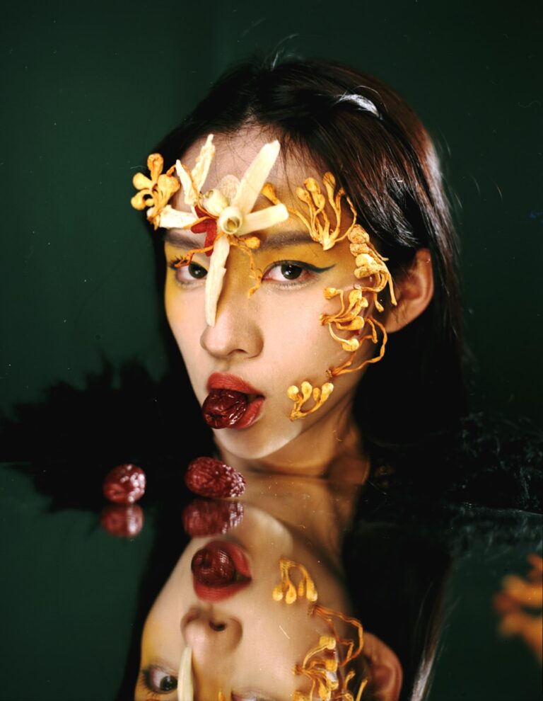 Woman with artistic makeup and dried fruit